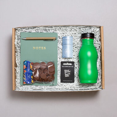 Teenage gift box with water notebook, pen and chocolate